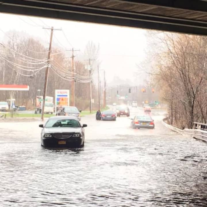 Numerous cars are stuck as several streets have flooded in town.