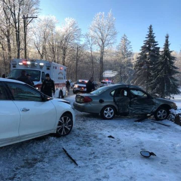 Two people were injured in a crash due to slippery roads.