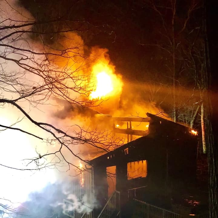 High winds hindered fire-fighting efforts during a large house fire in Goldens Bridge.