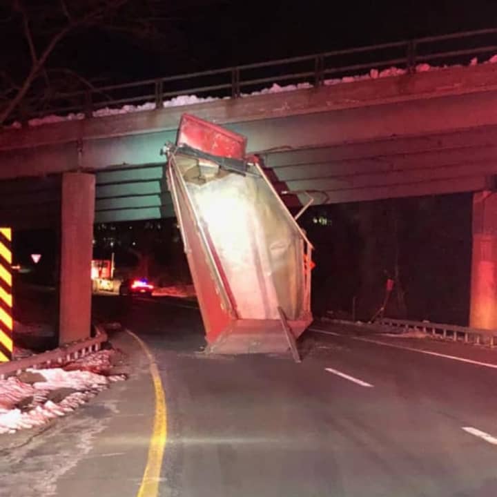 A dump truck slammed into an overpass on Westchester Avenue.