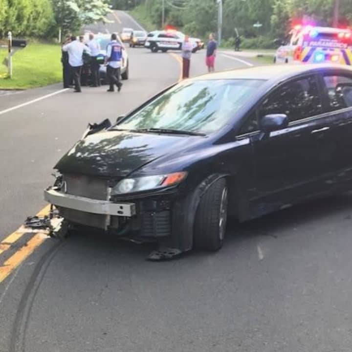 A single-vehicle crash snapped a utility pole.