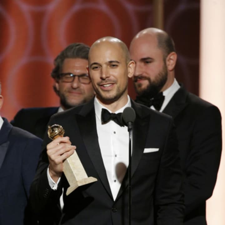 Fred Berger, middle, accepting the Golden Globe for &quot;La La Land.&quot;