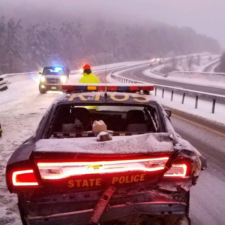 A New York State trooper escaped injury after his vehicle was rear-ended.