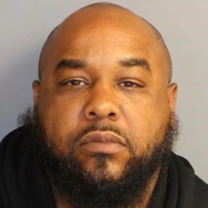 A warrant has been issued for the arrest of Christopher Smith, 41, who is being charged with contempt, violation of a restraining order and burglary, police say.