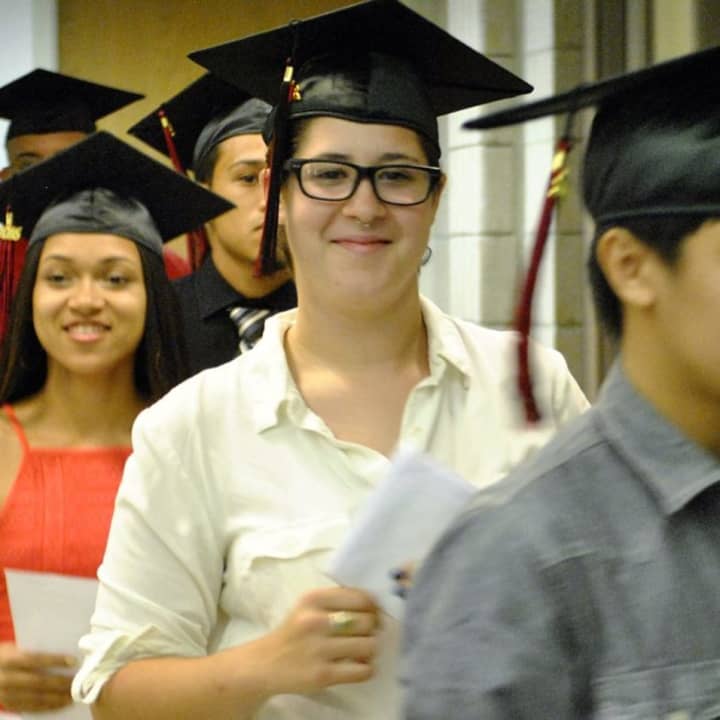 Proud graduates of ACE, an alternative high school in Danbury, receive their diplomas Tuesday.