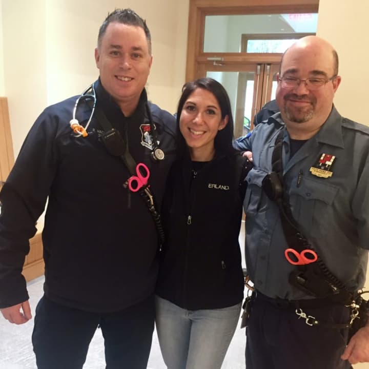 Stamford EMT Robert Hackett, Our Lady of Grace volunteer Francine Manfredi and Pete Kessler, president of the Stamford Paramedic Association, local 684, celebrate the new defibrillators at two Stamford nursery schools.