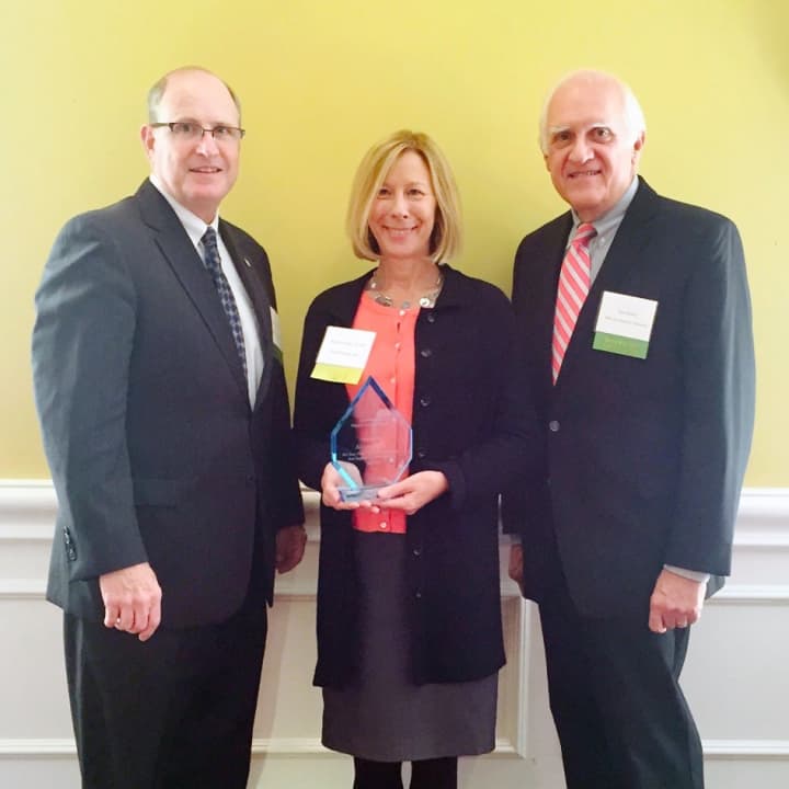 State Sen. Kevin Kelly (left), and Samuel Deibler, president of the Board of Southwestern Connecticut Agency on Aging, flank Alison Heim, director of social work at SilverSource Inc.