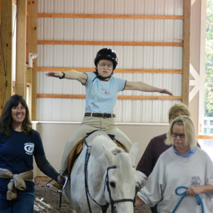 Annie Brautigam of Darien learning to balance on the horse