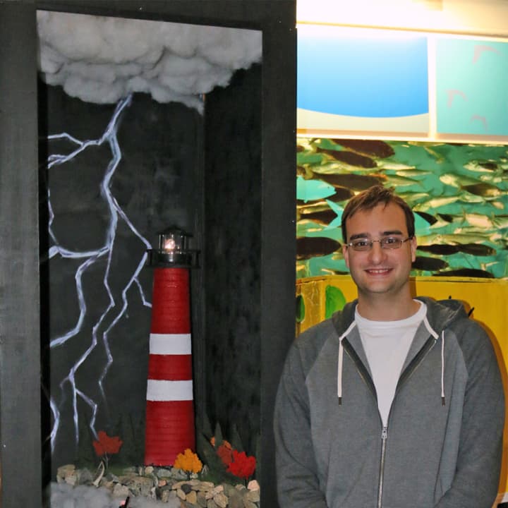 Robert Keene of Darien stands with his winning entry in the Maritime Aquarium 14th annual &quot;Festival of Lighthouses Contest.&quot;