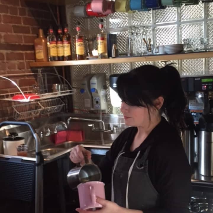 A barrista pours some brewed beans at Kurzhal&#x27;s Coffee, a cafe in the Peekskill Central Market on Main Street.