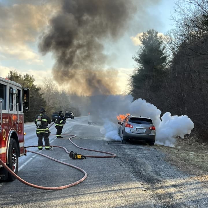 Firefighters were battling a car fire on I-395 in Auburn Tuesday afternoon, Jan. 31.