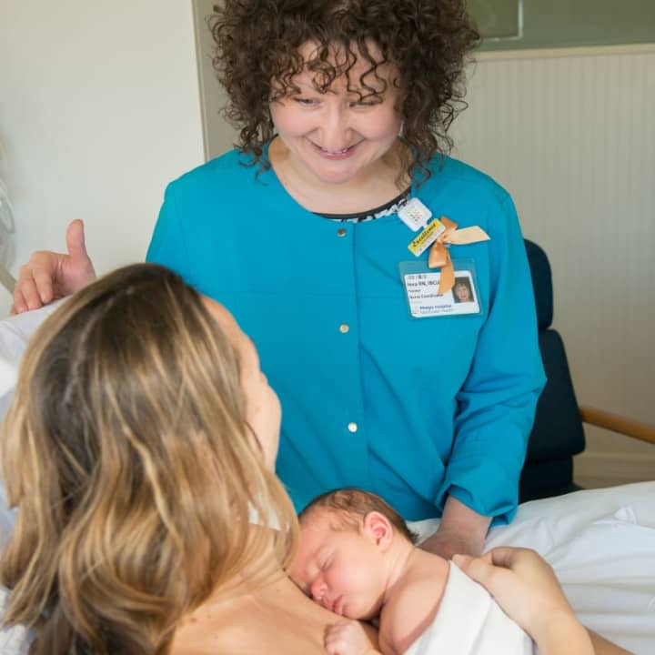 As part of the Baby-Friendly initiative, Yeva Posner, lactation consultant, encourages skin-to-skin contact between a new mother and her baby.