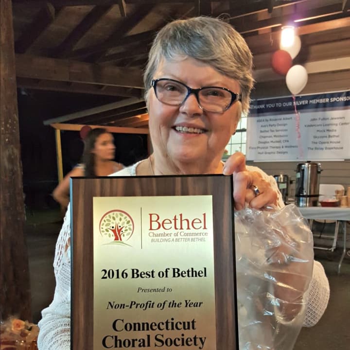 Connecticut Choral Society President Jill Heidel shows off the award for Nonprofit of the Year.
