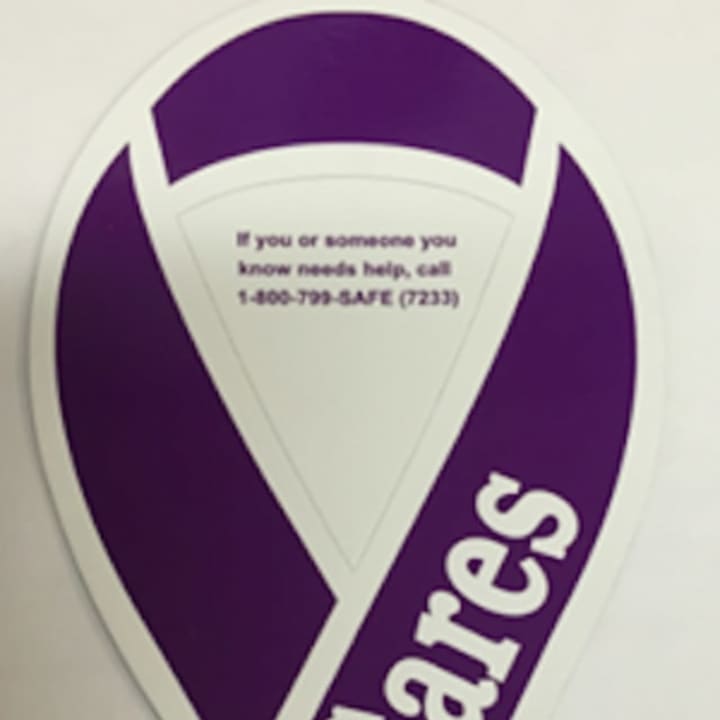 In support of Domestic Violence Awareness month, all Connecticut State Police will be displaying magnets of purple ribbons on all marked cars. 