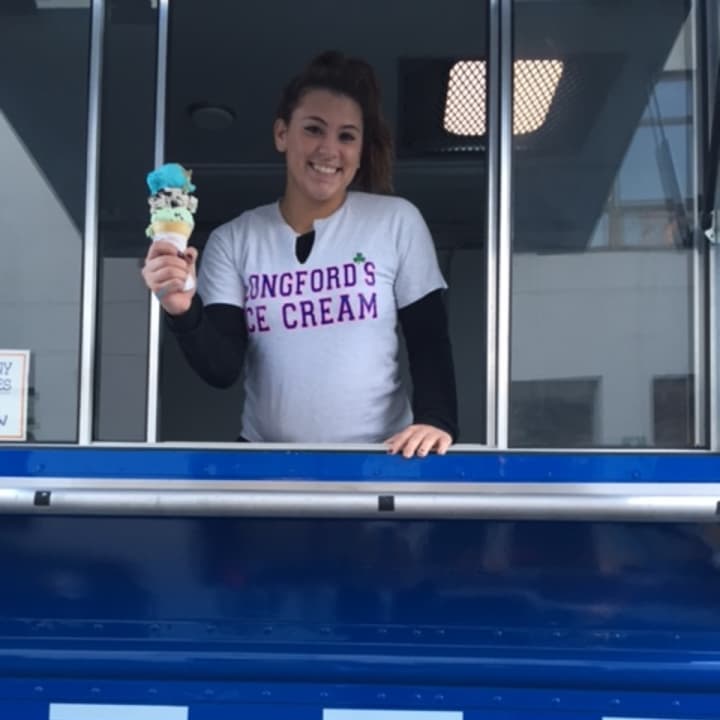 Cali Smith poses in Longford&#x27;s ice cream truck holding a triple decker cone. 