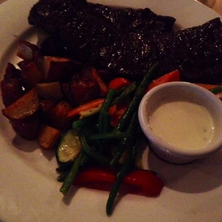 A Char steak with Gorgonzola sauce on the side.