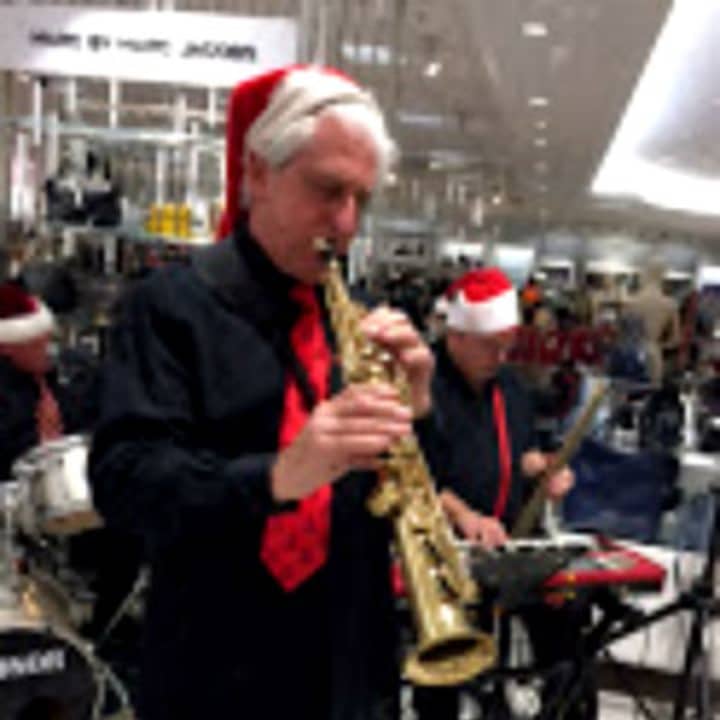 The Broadway Knights entertained holiday shoppers at Lord &amp; Taylor&#x27;s Channel area Saturday, Dec. 12 at the Garden State Plaza, Paramus. Dr. Charles Marranzano of Cliffside Park is seen here playing sax.