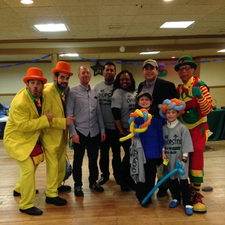 Teaneck Deputy Mayor Elie Katz, rear, second from right, at his annual Holiday Party for kids to benefit Hackensack University Medical Center&#x27;s Tomorrow&#x27;s Children.