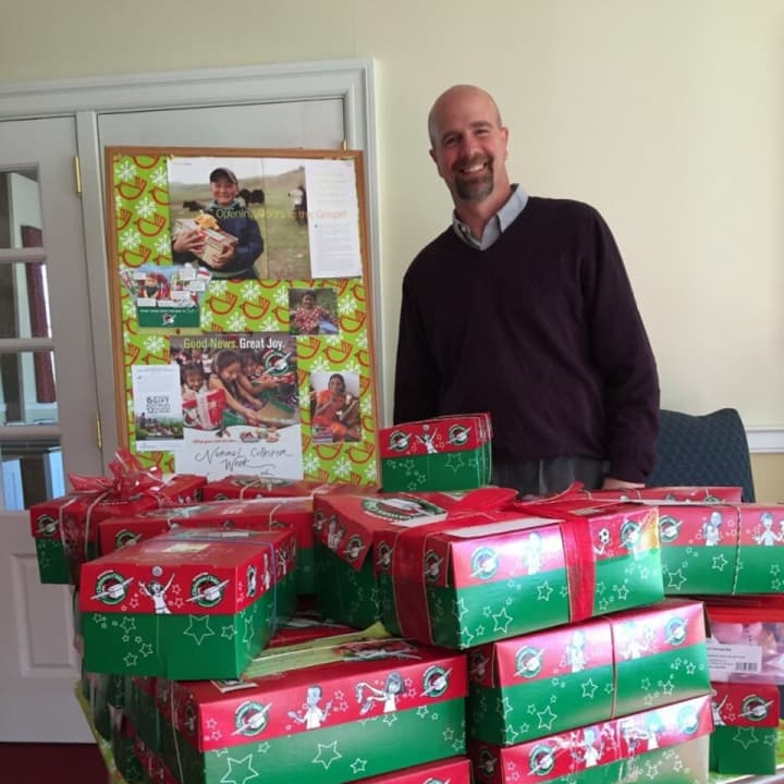 Rev. Steve Sayer and volunteers have organized about 30 boxes for the first donations of Operation Christmas Child, a benefit at Harrington Park Community Church. 