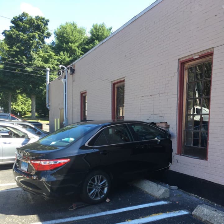 A car slammed right through the brick wall at Styles Salon at 940 Boston Post Road in Milford.