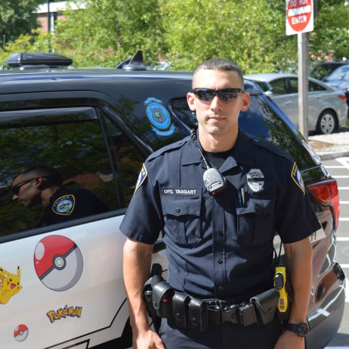 Officer Kevan Taggart offers safety tips to Pokémon Go players in Darien Tuesday.