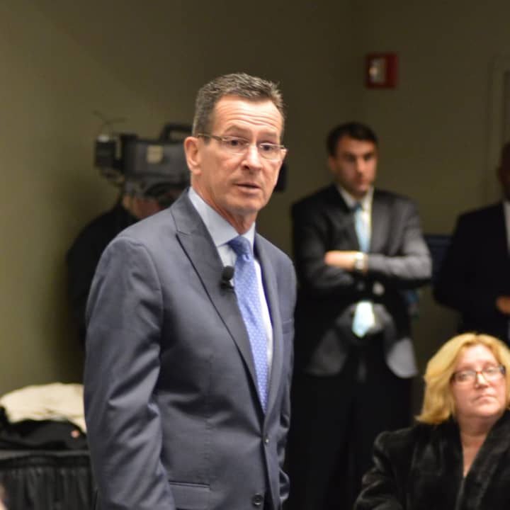 Gov. Dannel Malloy addresses the audience in a town hall forum at the Gen Re Auditorium at the  UConn-Stamford Campus on Thursday evening.