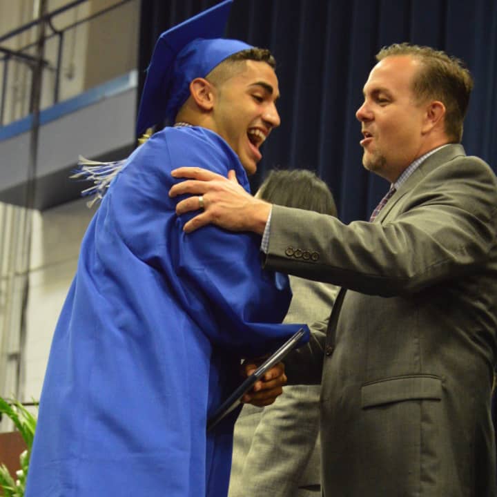 A happy graduate at the Abbott Tech High School commencement exercises Monday evening at WestConn in Danbury.