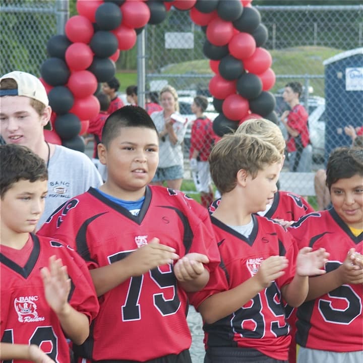 Football players are introduced at a BANC pep rally at the Western Middle School.
