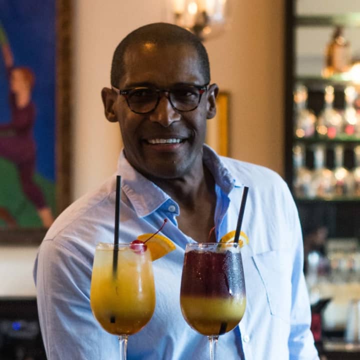 Owner Alvin Clayton of Alvin &amp; Friends in New Rochelle with the restaurant&#x27;s sangria options.