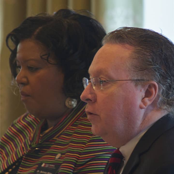 Belinda S. Miles, President of Westchester Community College (L) listens, as Michael J. Smith, President of Berkeley College, makes a point. 