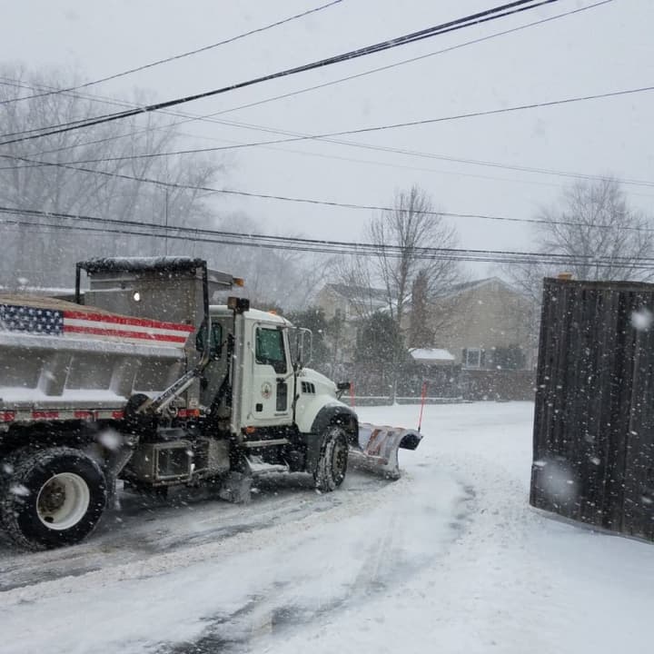 A city plow pulls out onto Haig Avenue in Stamford during Thursday&#x27;s storm.