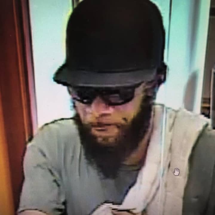 Police are searching for this man who is accused of robbing a bank.
