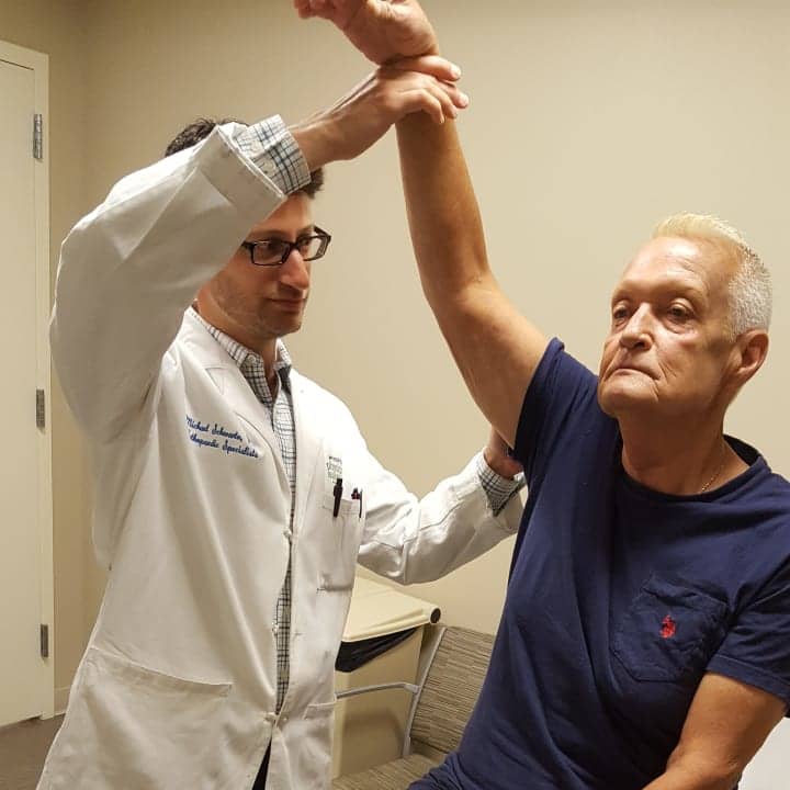 Dr. Schwartz treats John Rimmer for acute shoulder pain.