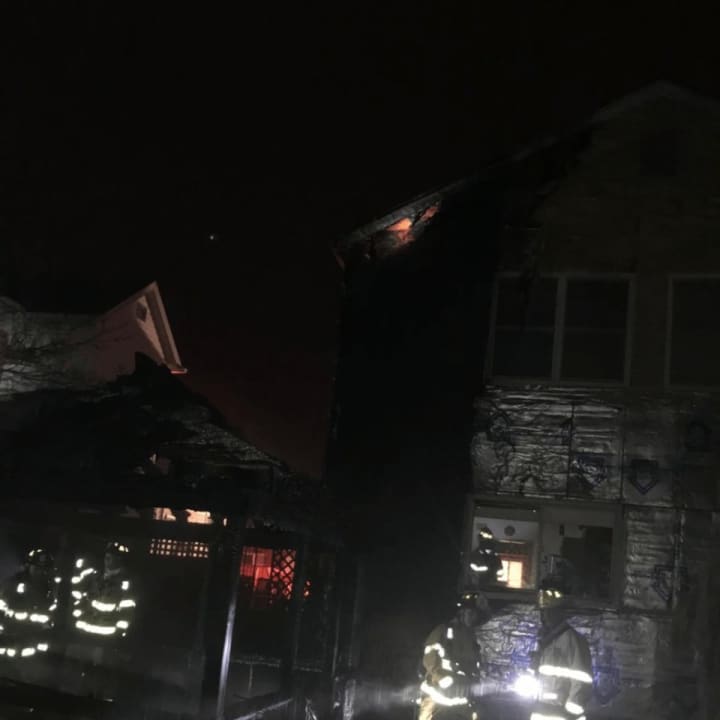 A fire in a Stamford gazebo spread to an area home.