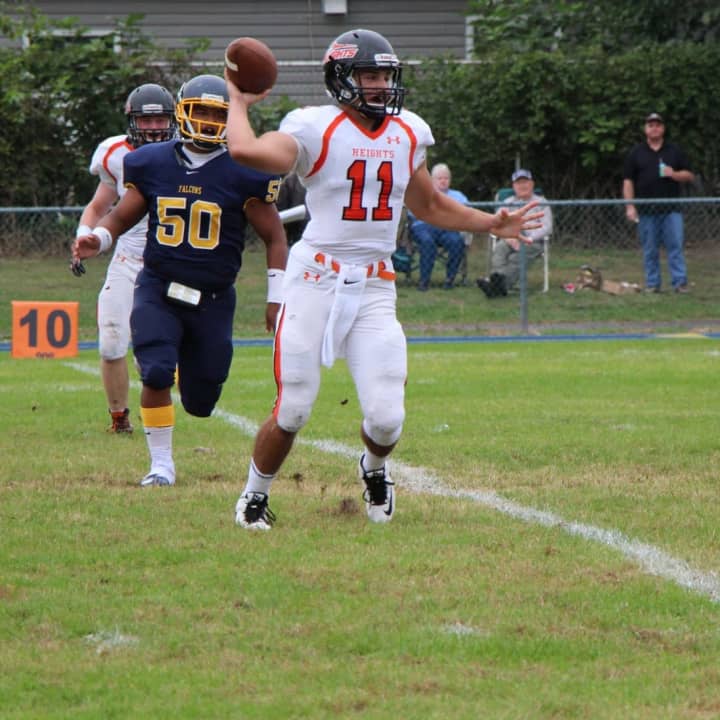 Hasbrouck Heights quarterback Frank Quatrone looks to the end zone early in the first quarter against Saddle Brook.