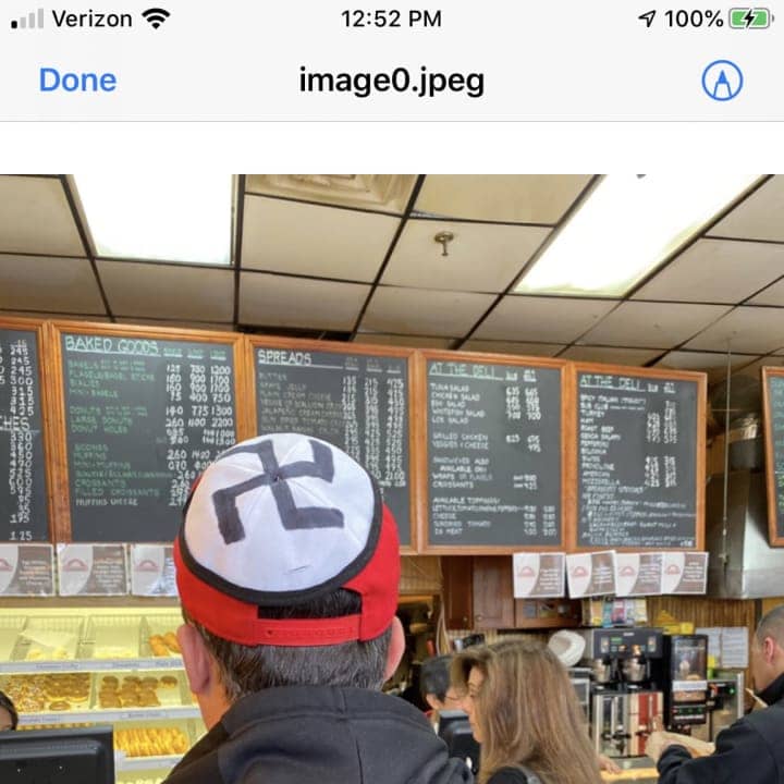 A man wearing a swastika on his hat was escorted off the property of a White Plains diner.