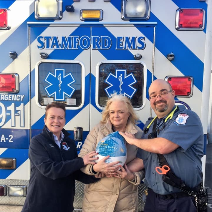 Patricia Squires, Stamford EMS Chief and C.E.O., Kate Lombardo, Executive Director of the Food Bank of Lower Fairfield County and Peter Kessler, President of the Stamford Paramedic Association, local 684.