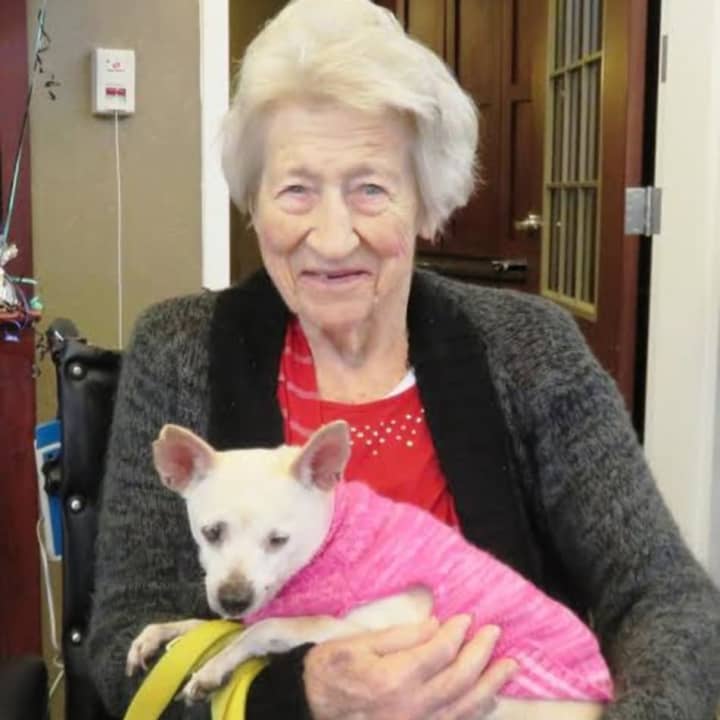 Heritage Manor resident Edna Hughes holds Tofu.