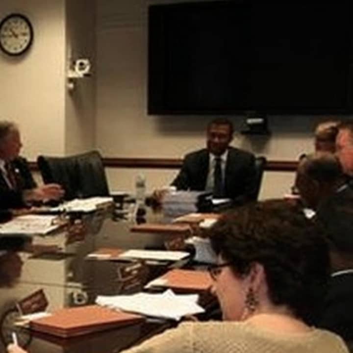 Federal Housing Monitor James Johnson (far end of table) at a meeting with the Westchester County Board of Legislators. 