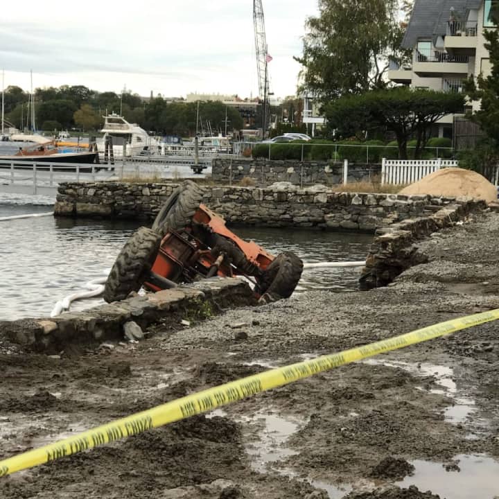 A forklift operator was a little wet, but unharmed after a seawall collapse sent the machine into the water.
