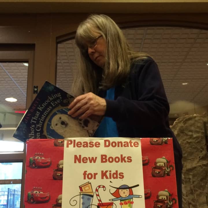 Ringwood children&#x27;s Librarian Ann Marie Solch looks through donations made to the Ringwood Public Library.