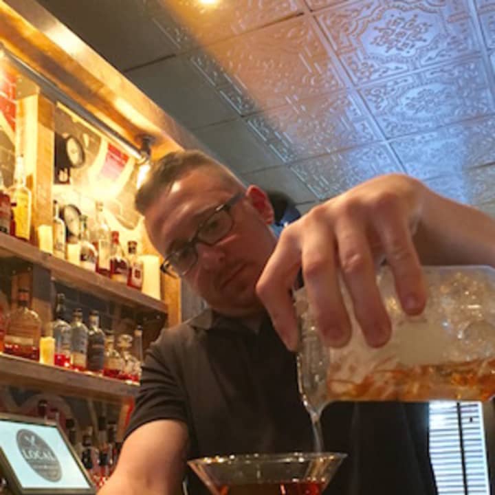Bar manager John Kubicsko mixes a cocktail at Local in South Norwalk.