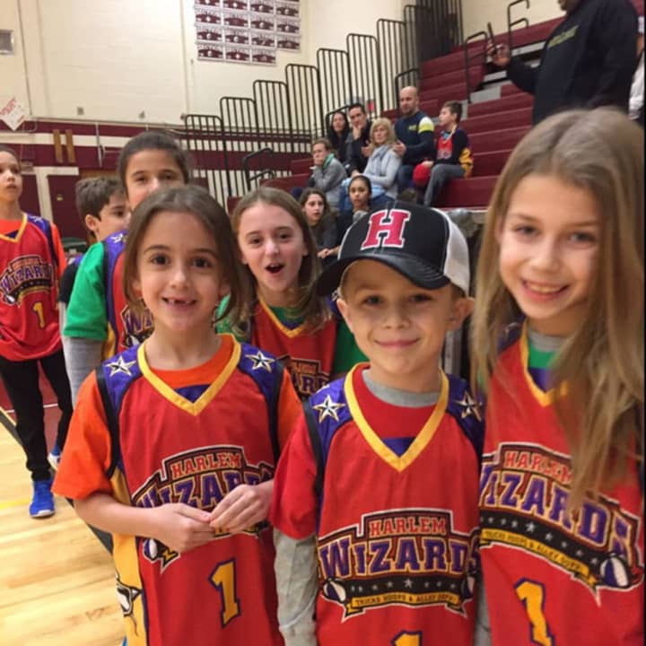 Harrison teachers took on the Harlem Wizards on Jan. 14 during a fundraising basketball game that collected money for several programs and clubs.