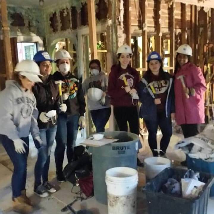 Volunteers for Habitat for Humanity of Westchester work on renovating a home for a family in need. The group has set several events in January, including one where valentines and care packages will be made for U.S. military folks serving overseas.