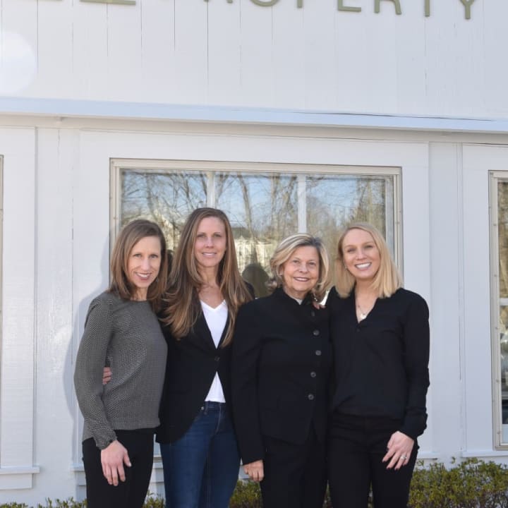 Shown from left are Rebecca Morrison, Opus alumni initiatives coordinator, Tami Hughes and Eileen Hanford of Halstead Property, and Anika Charron, Co-President of Opus. A March 1 luncheon will raise  money to send Stamford kids to camp.