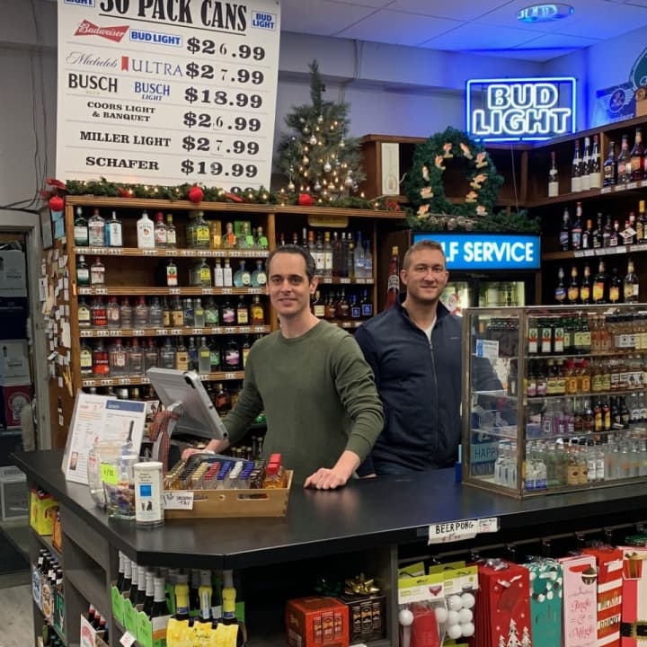 Michael McGrath and Michael Perretta, brothers-in-law and new co-owners at the newly renovated Vic’s Liquor