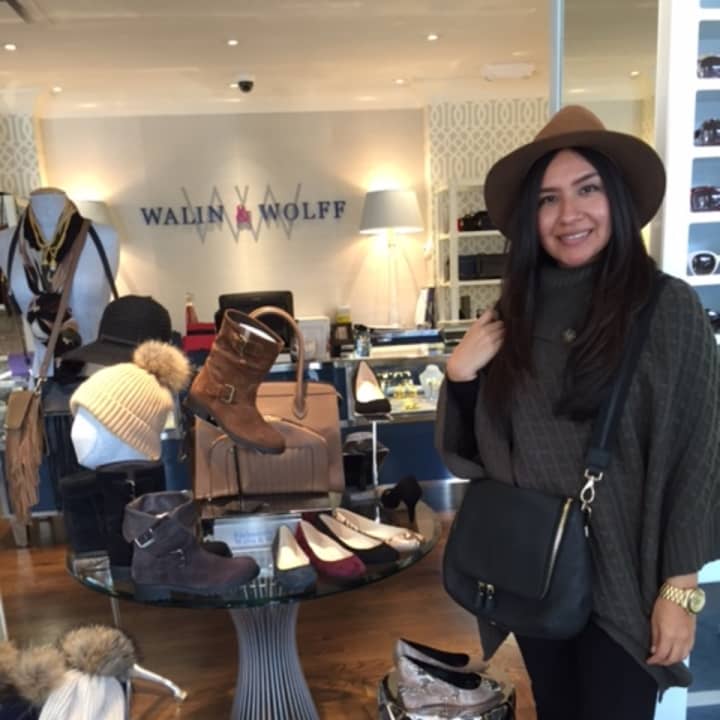 Salesperson Minerva Flores of Walin &amp; Wolff models some fall items. 