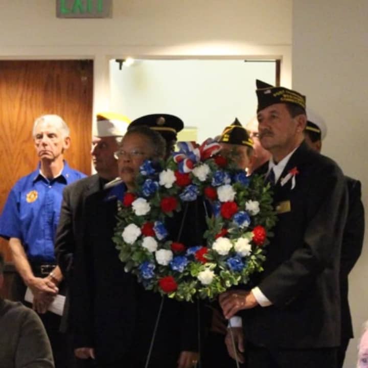 Members of local veterans organizations placed a memorial wreath during the 2016 Veterans Day services at Westport Town Hall.