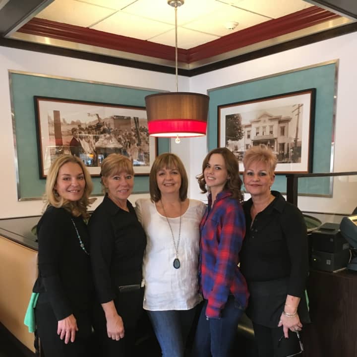 Owner Dimitra Tsilfides in middle with the Monroe Diner crew.
