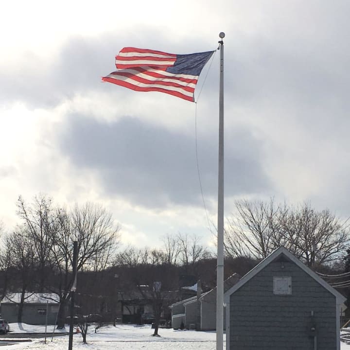 A strong wind blows Saturday at the PAL Building in Danbury near Candlewood Lake.